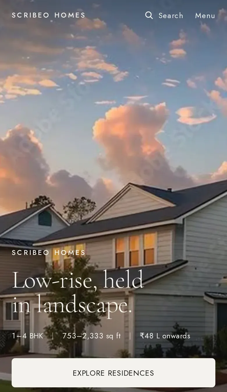 Scribeo Homes: a low-rise residence at dusk under the line “Low-rise, held in landscape.”